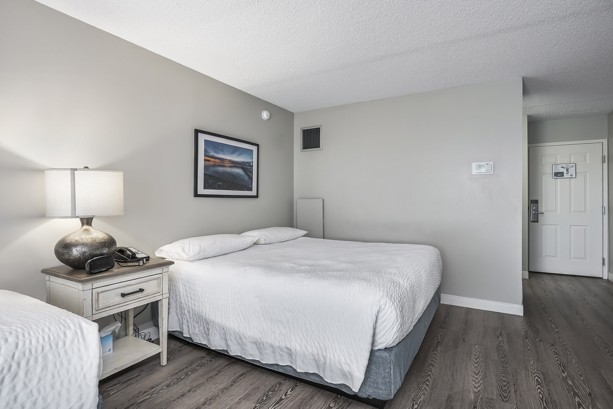 Comfortable bedroom, tastefully decorated.
